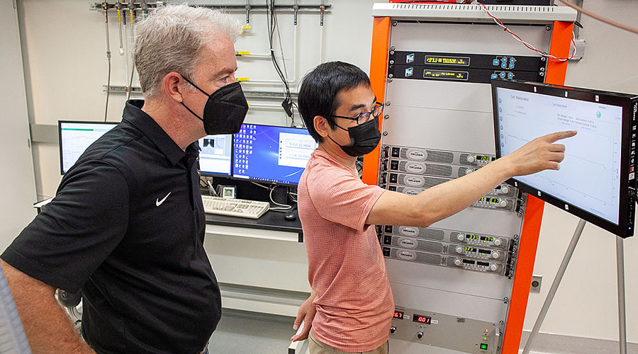 Chenhui Yan teaches Michael Rodgers about his work.