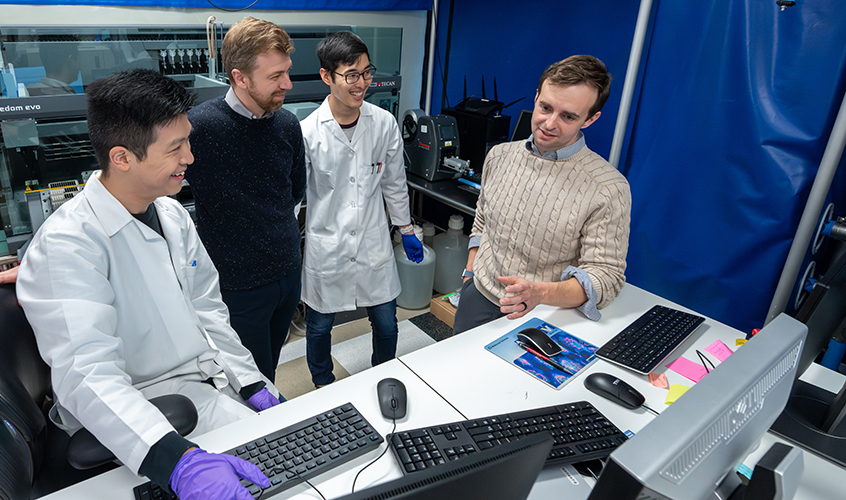 Researchers in the high throughput screening lab