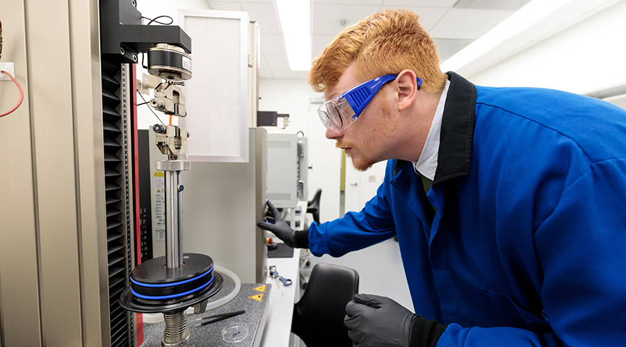 Nicholas Boynton looks at piece of equipment