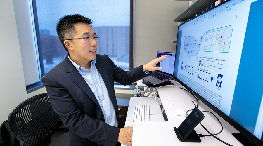 Liang Jiang at his computer