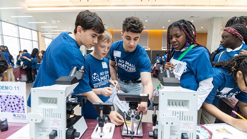 South Side Chicago middle school students look at high-resolution microscopes at the UChicago Pritzker Molecular Engineering’s 2025 No Small Matter Molecular Engineering Fair