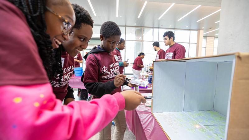 Middle schoolers participate in hands on experiments