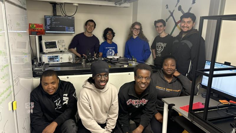 Students in quantum laboratory posing for picture