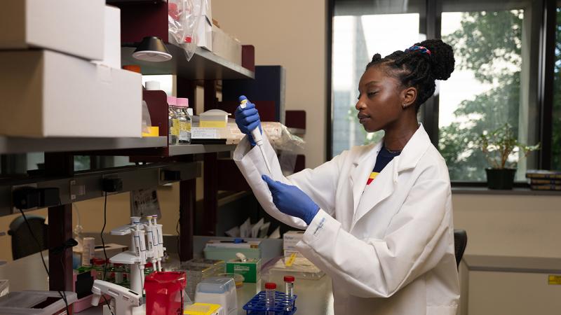 Student working with pipette