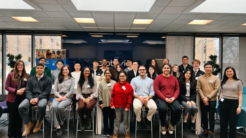 Large group of students and staff pose for photo