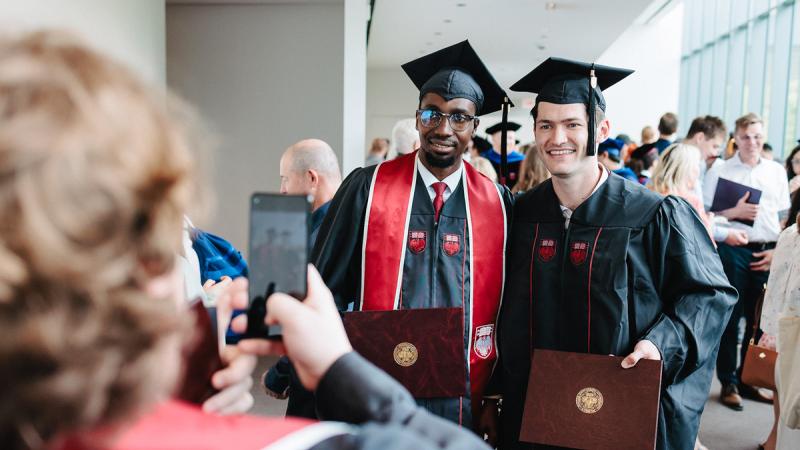 Two grads posing for a photo