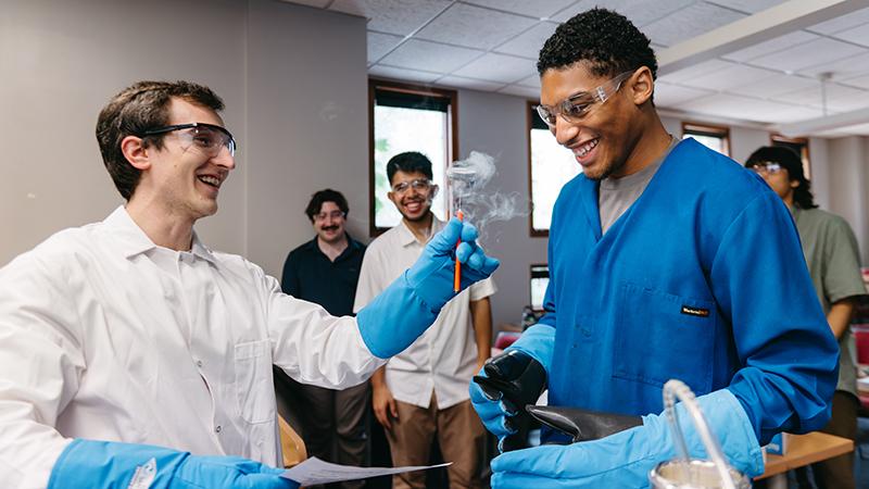 Instructor hands student a vial of nitrogen