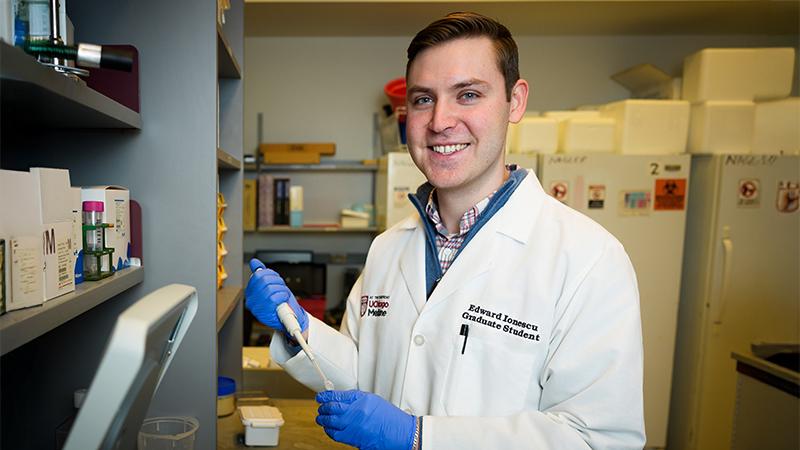 Edward Ionescu holding a pipette