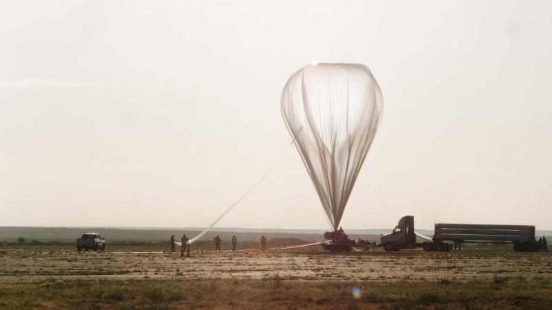 NASA high-altitude balloon inflated as it readies to rise over the New Mexico desert.