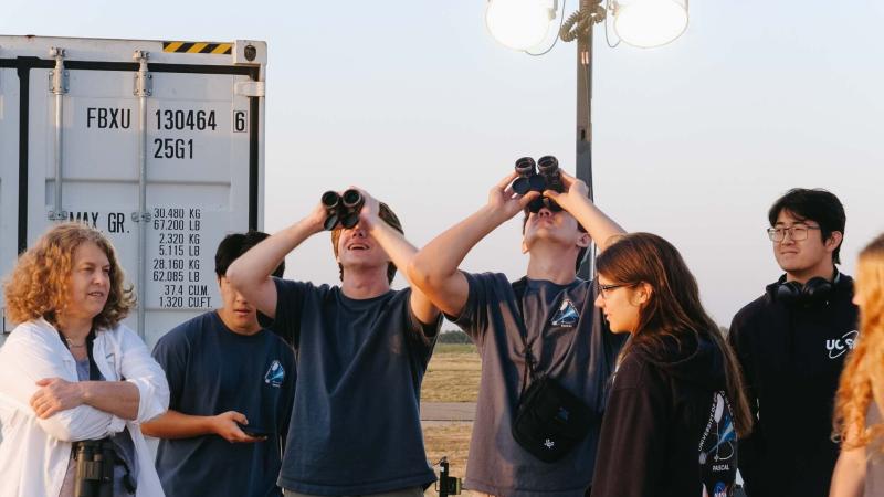 Researchers observe through binoculars