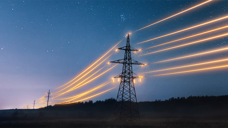 Power pylons with the wires artificially illuminated