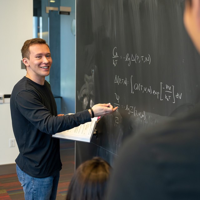 Two PME students share a moment during a claass break