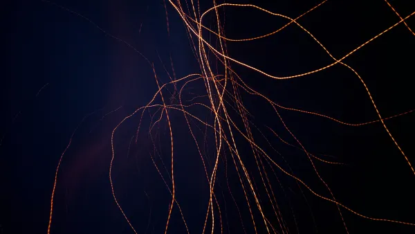 Yellow-orange lines across a dark background