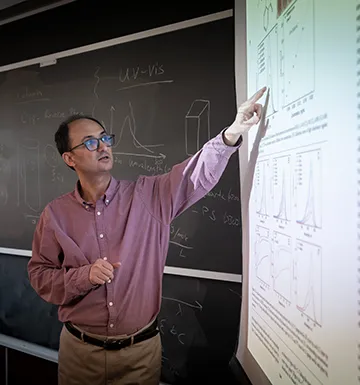 Instructor pointing at projected screeen