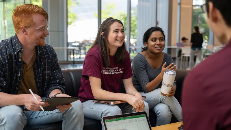 Four students sitting and chatting