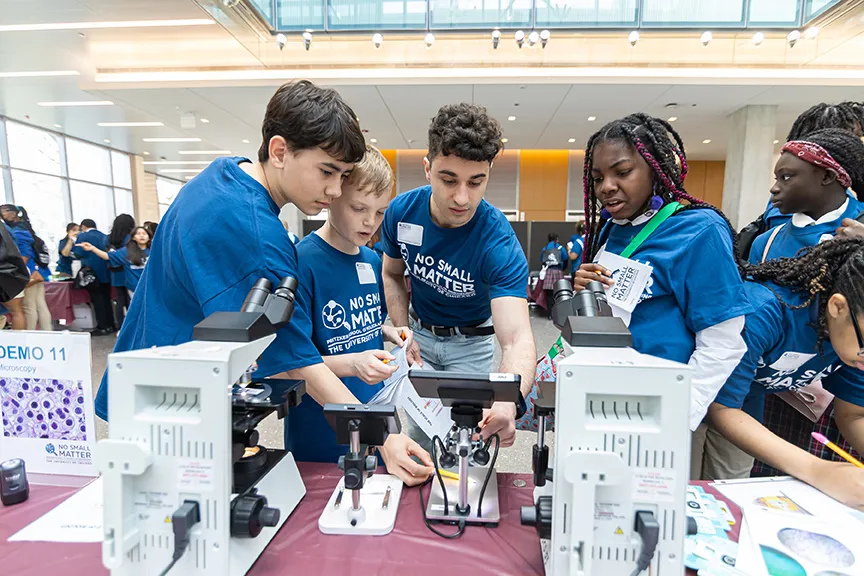 South Side Chicago middle school students look at high-resolution microscopes at the UChicago Pritzker Molecular Engineering’s 2025 No Small Matter Molecular Engineering Fair