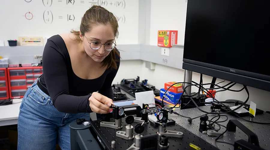 City Colleges of Chicago student in an optical lab at the University of Chicago Pritzker School of Molecular Engineering