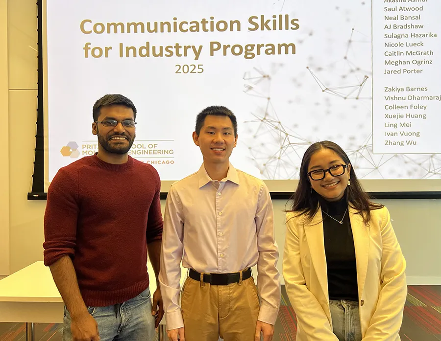Three scientists in casual clothes stand in front of a screen for the UChicago PME Communication Skills for Industry Program