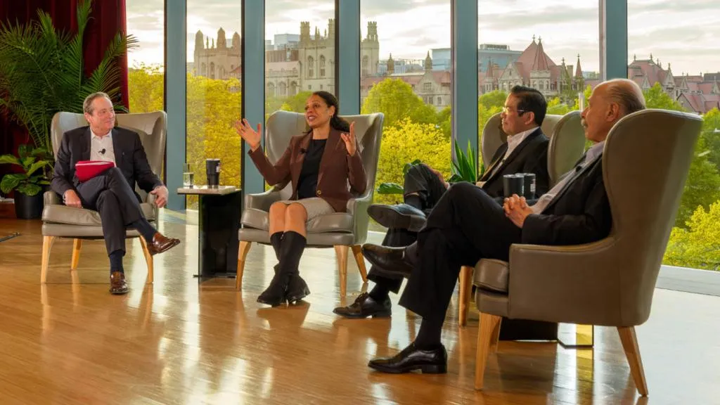 Four people sitting in a semi-circle