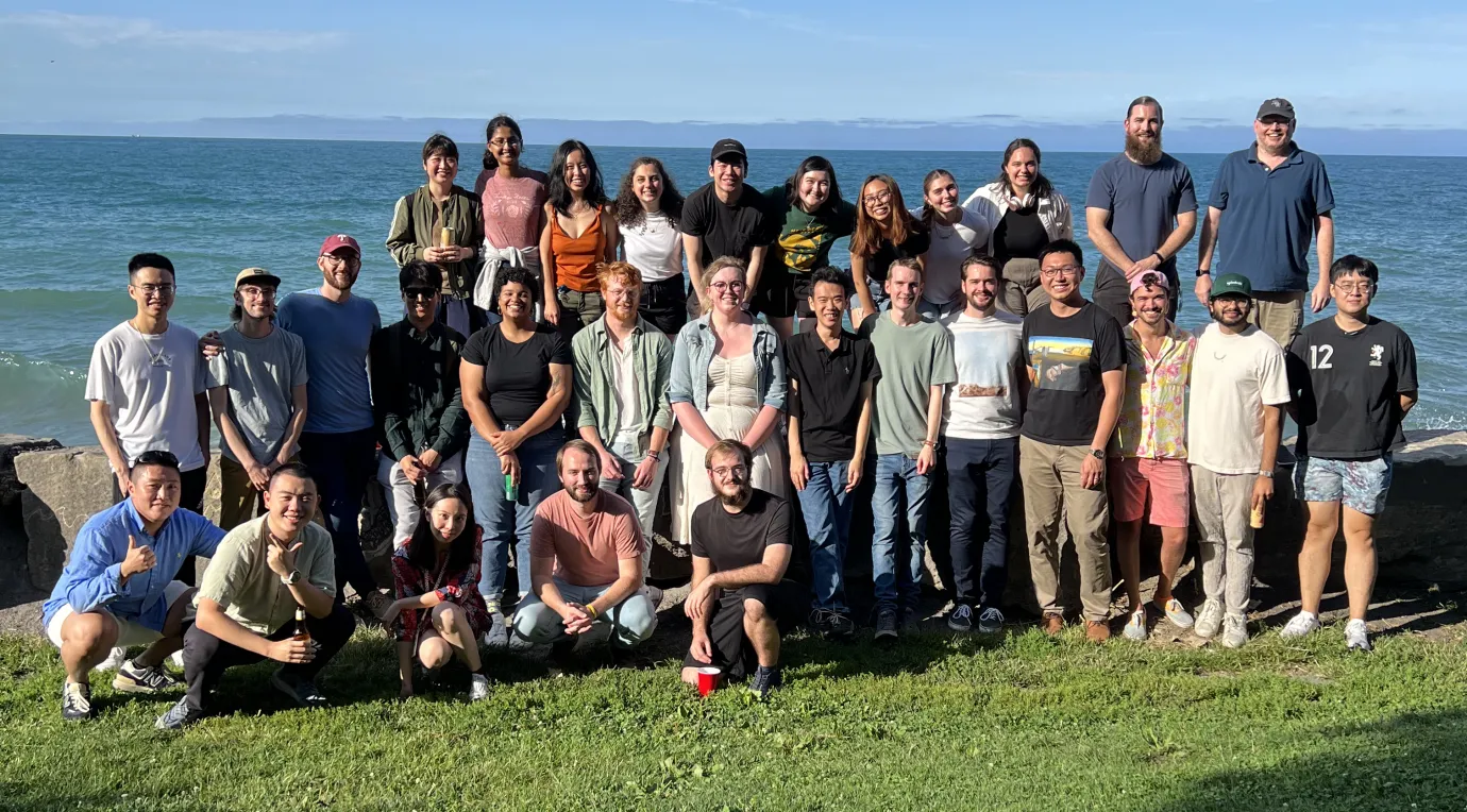 Members of the Rowan Group standing in front of Lake Michigan