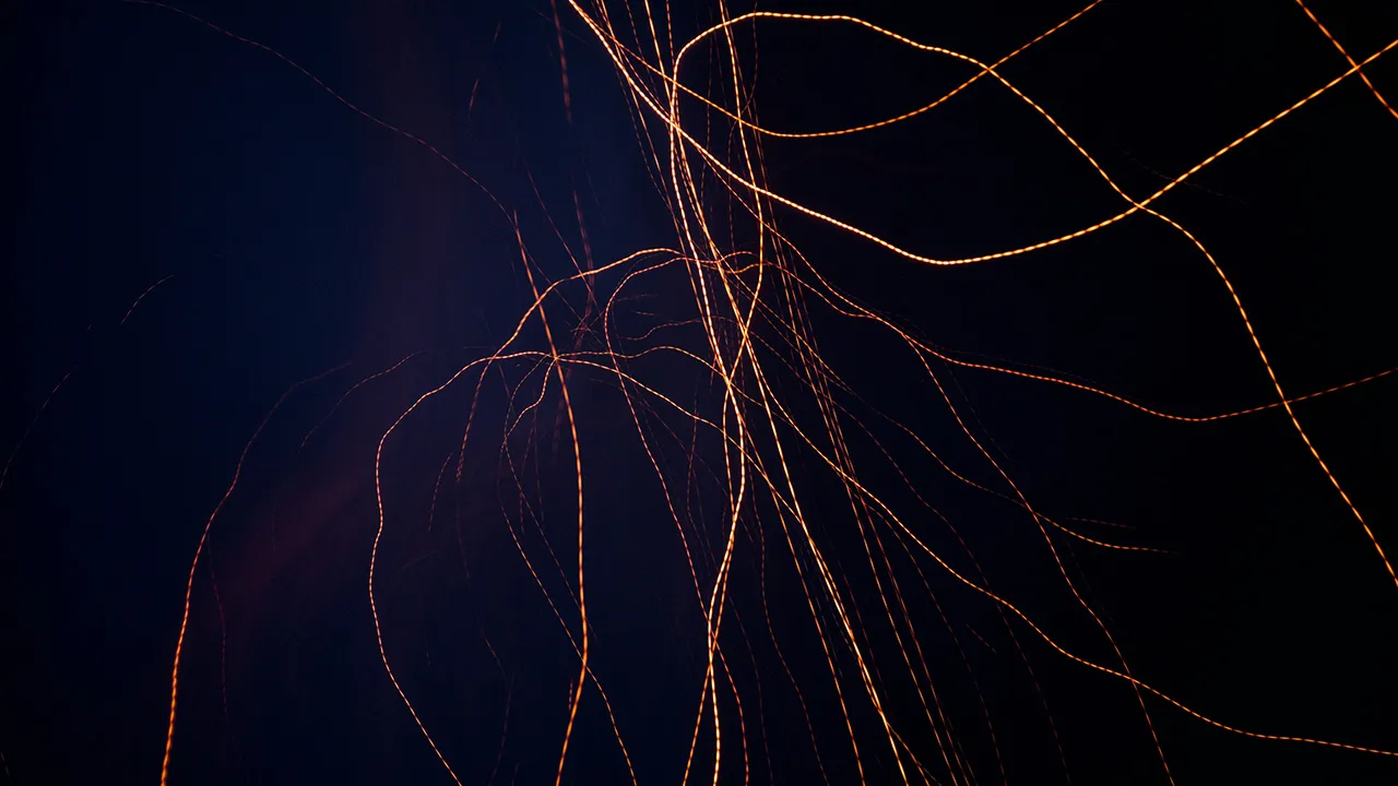 Yellow-orange lines across a dark background
