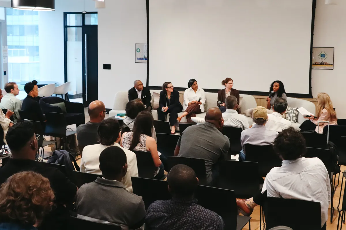 Panel speaking before a crowd