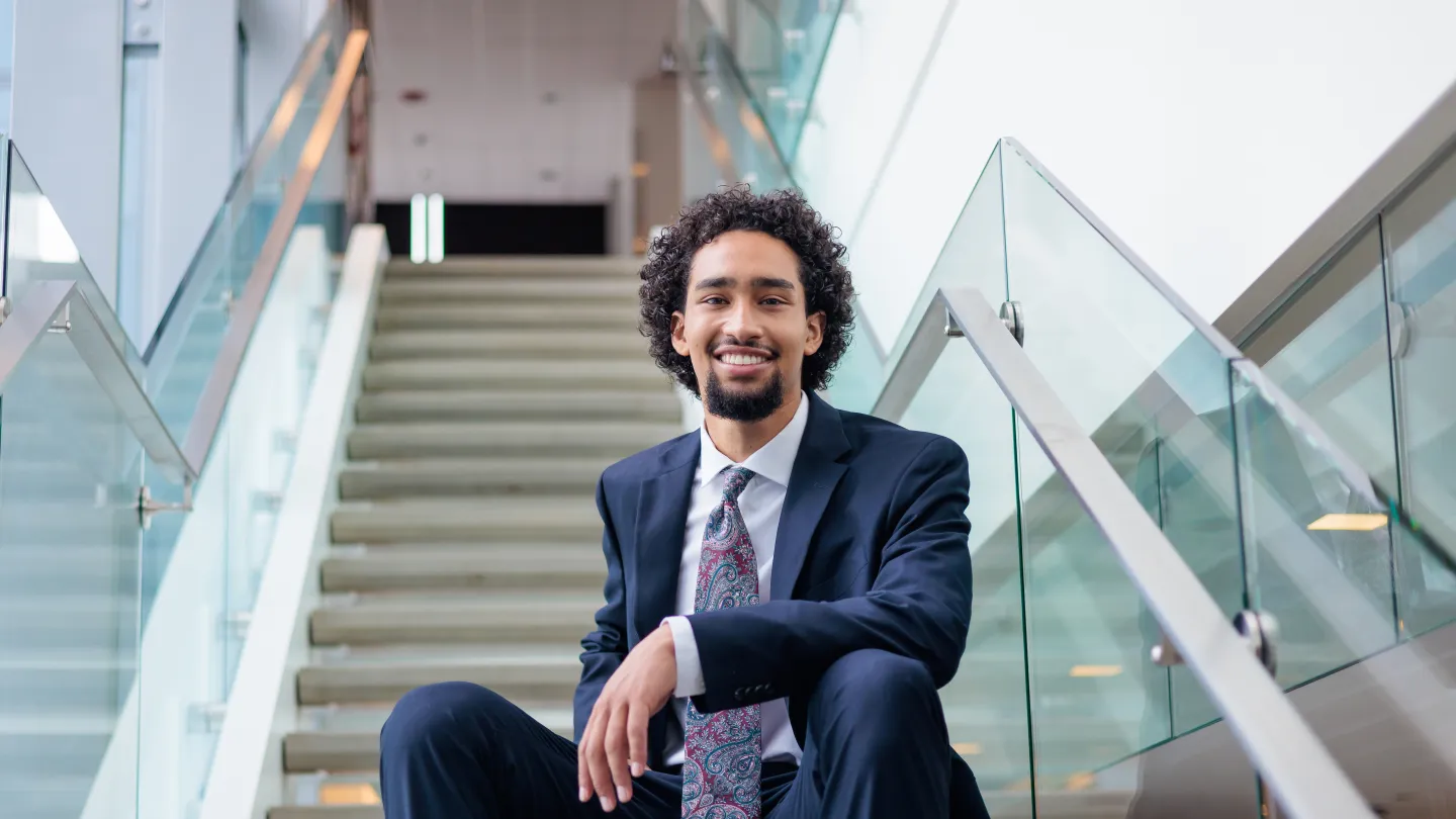 Student sitting on staircase