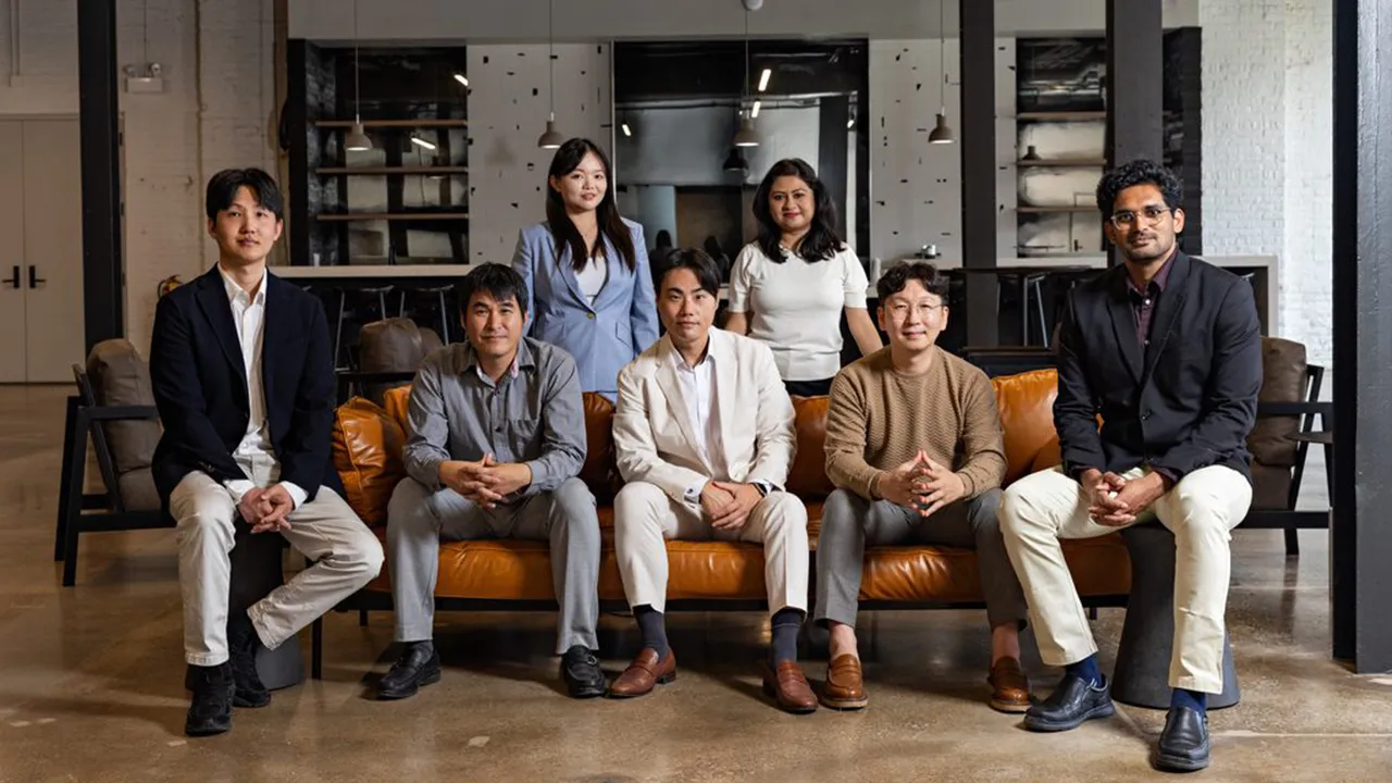 Seven people sitting on and around a couch