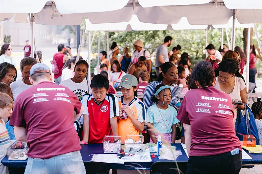 University of Chicago students and faculty run science displays for a group of children at the 2025South Side Science Festival 