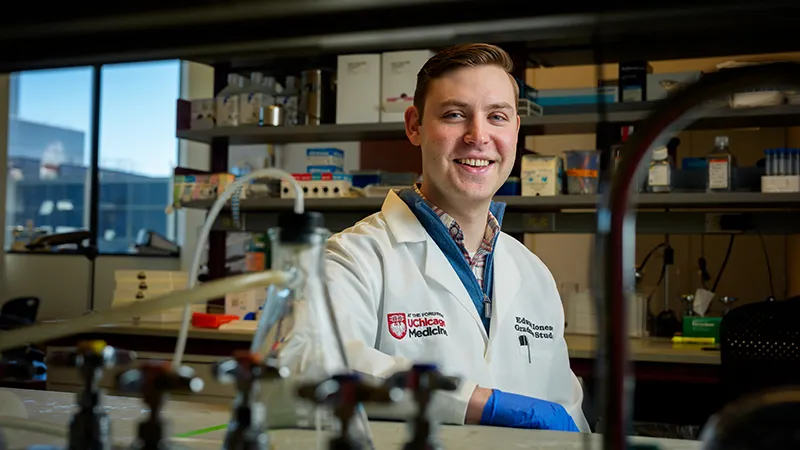 Edward Ionescu sitting at a research bench